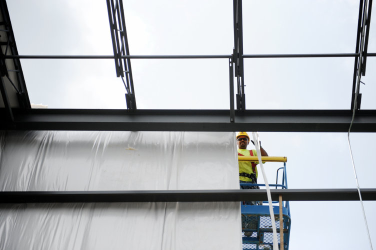 The Zartman team works on put the siding on a new distribution facility built in Milton.