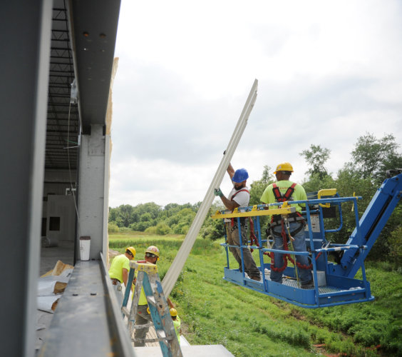 The Zartman team works on put the siding on a new distribution facility built in Milton.