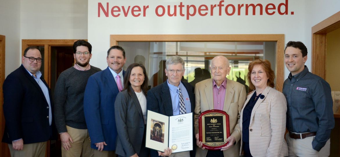 PA State Rep Michael Stender, Alex Zartman, Deputy Secretary Jerry Mullery, PA Secretary of Labor & Industry Nancy Walker, David Zartman, Gene Zartman, PA Senator Lynda Schlegel-Culver, and Dan Zartman pose with the 2025 GASE Award at the Zartman Construction office in Northumberland on Monday morning.